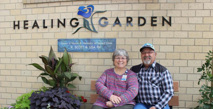 donors sitting next to healing garden