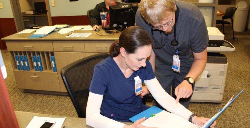 hospital staff examining chart