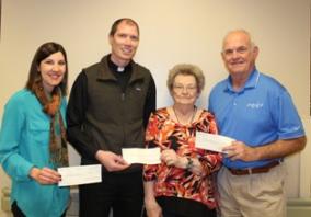 Jessica Prussa of West Holt Medical Services Foundation, Fr. James Weeder of St. Joseph's Catholic Church, Phyllis Langan, and Doug Kubik of The Atkinson-Stuart Country Club